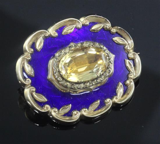 A Victorian, ornate gold, citrine and blue guilloche enamel oval brooch, 42mm.